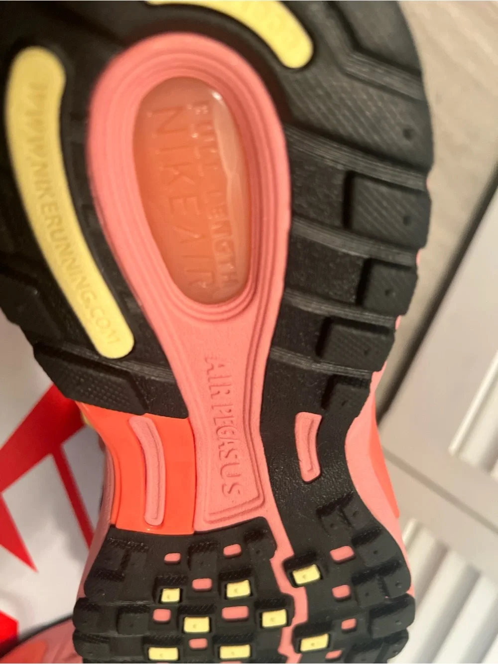Nike men’s Pink and Gray Sneakers with Yellow Swoosh